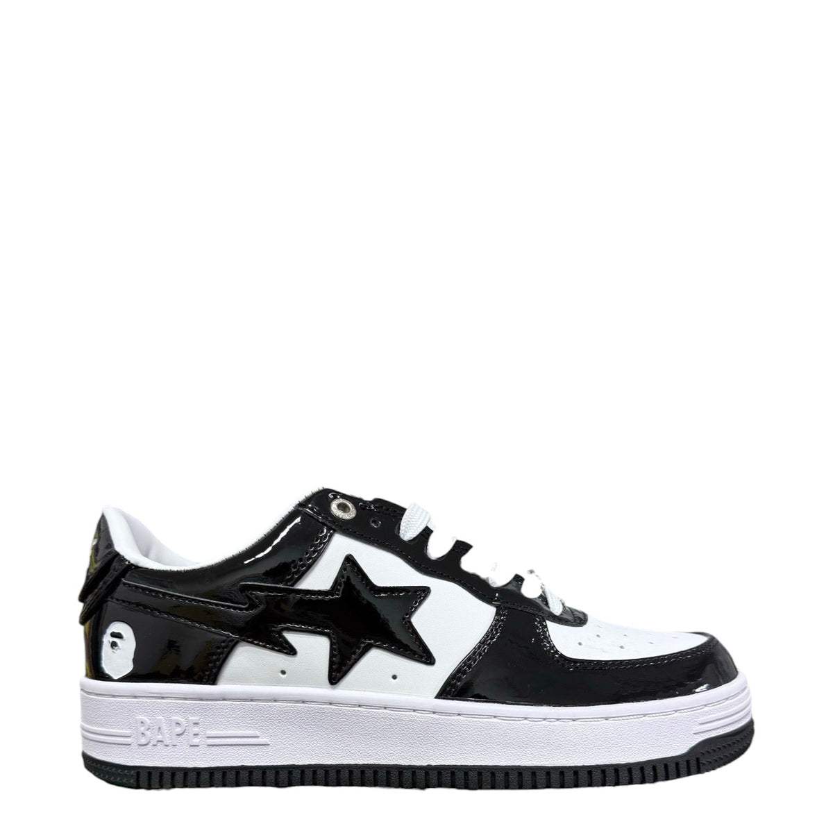 Luxury Chef BAPESTA sneakers in black and white patent leather with a star logo and ape head detail.
