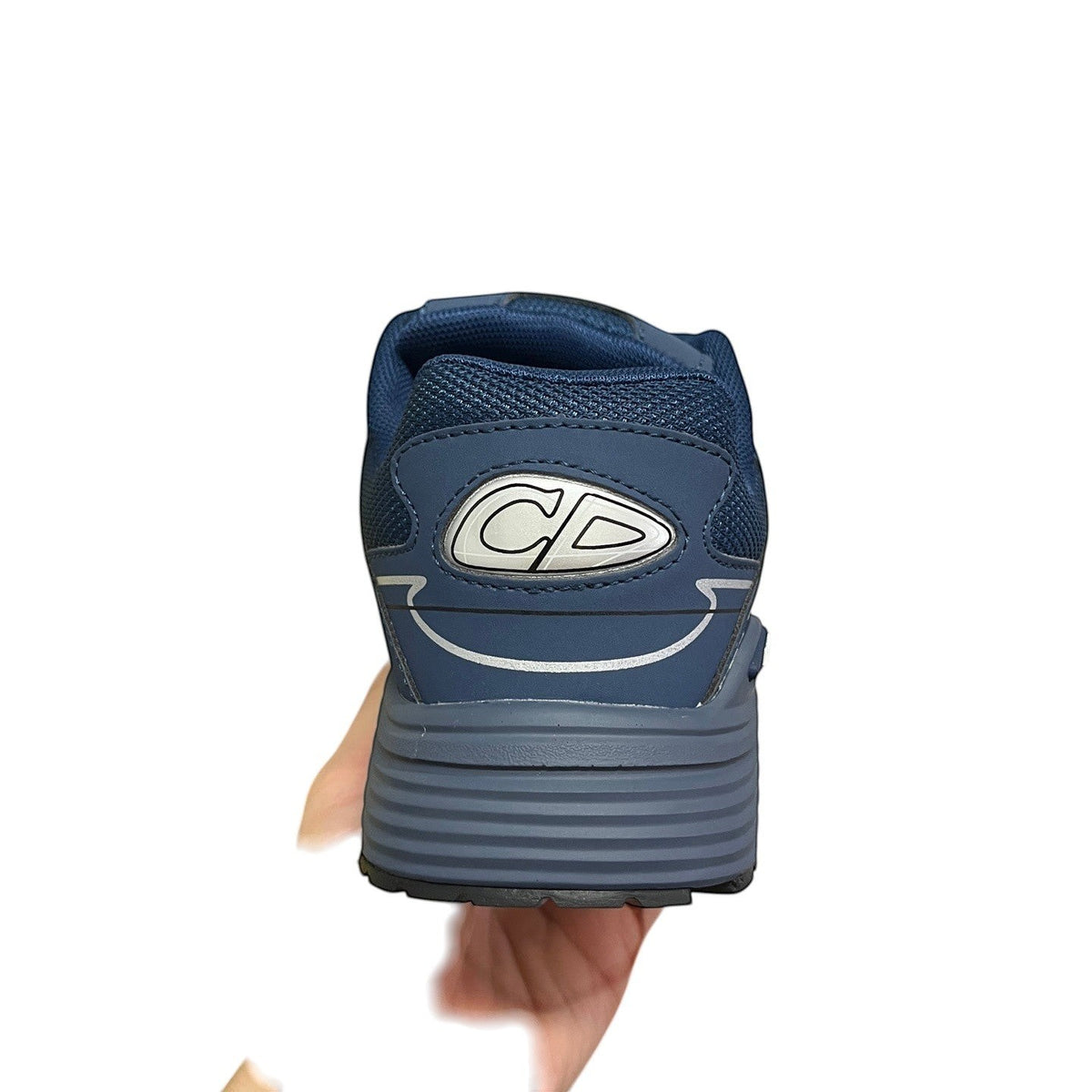 Luxury Chef DIOR B30 navy blue athletic sneakers with CD logo detail and reflective accents.