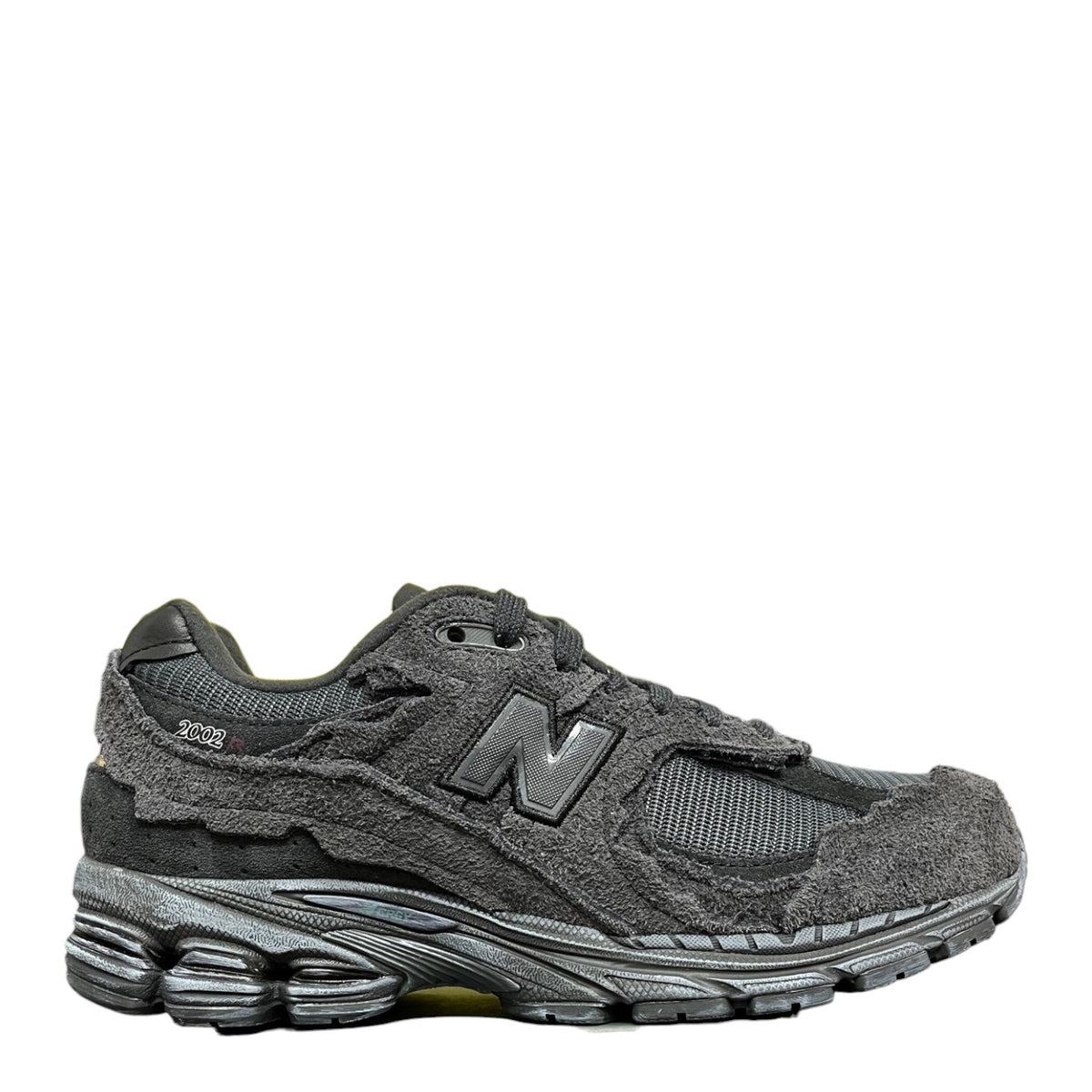 Luxury Chef New Balance 2002R dark grey suede and mesh sneakers with distressed detailing.