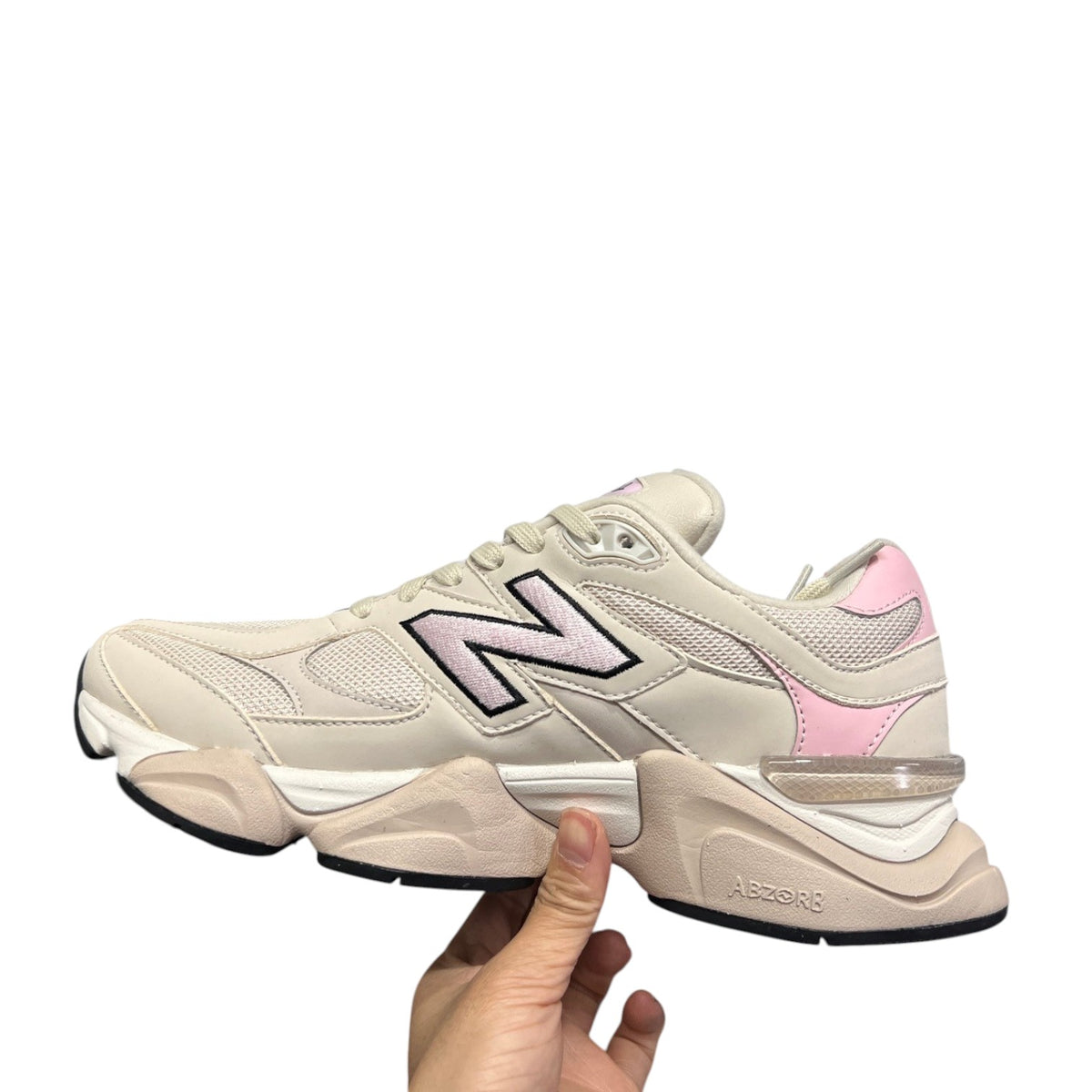 Luxury Chef New Balance 9060 sneakers in cream with light pink accents and a chunky sole.