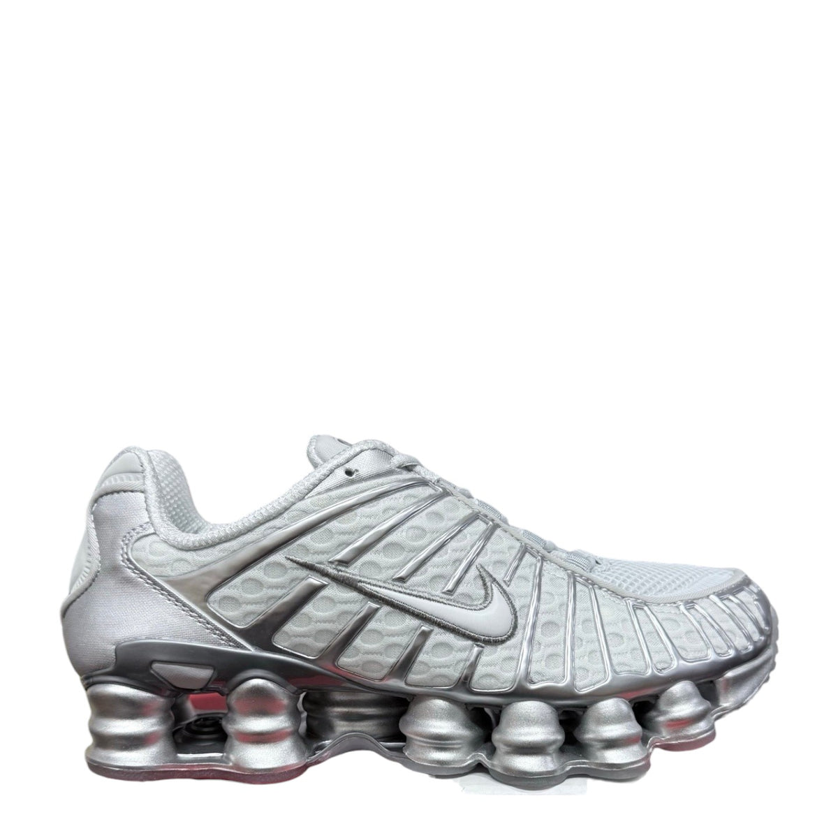 Luxury Chef Nike Shox TL women's sneakers in silver metallic mesh and synthetic material with signature Shox cushioning.