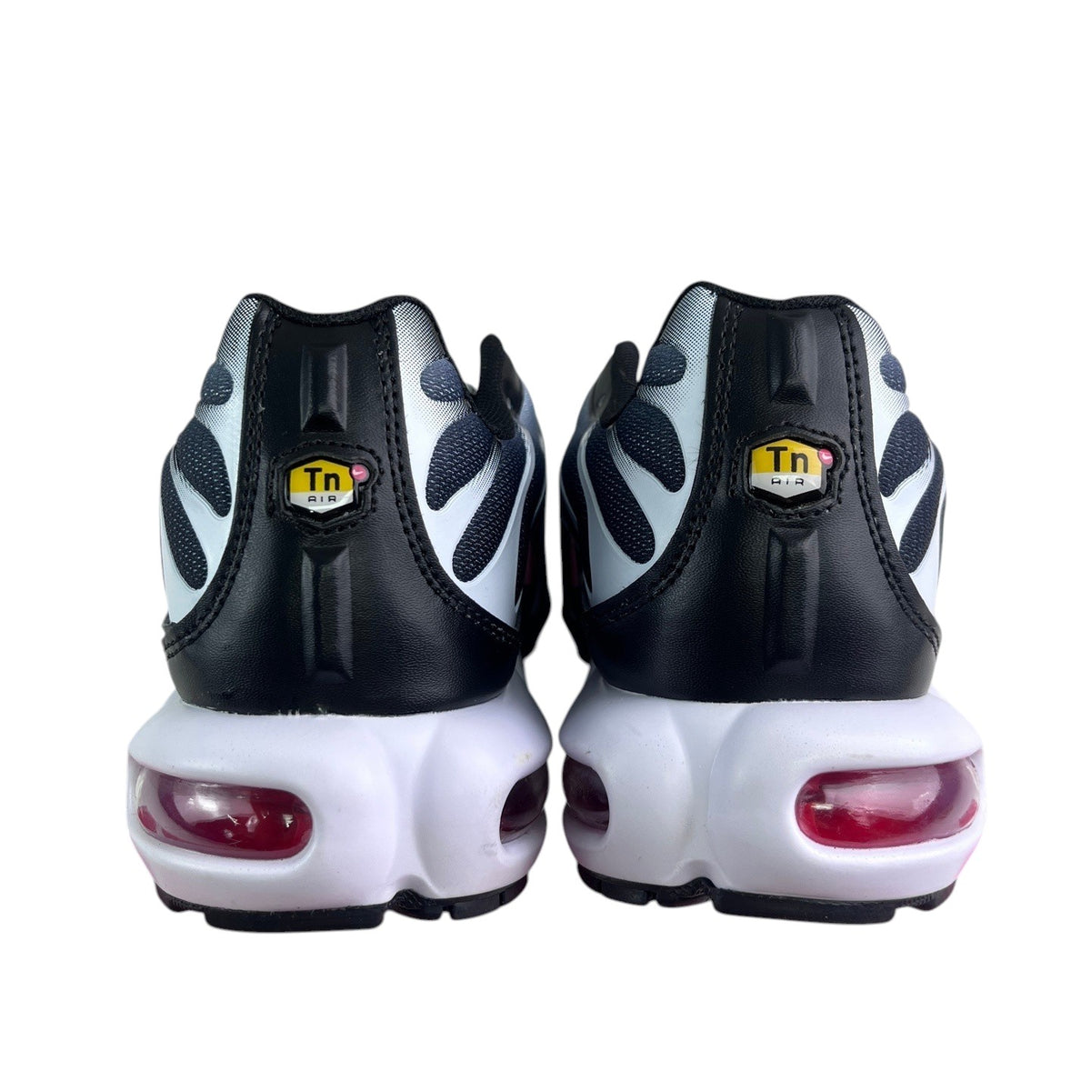 Luxury Chef Nike TN Air Max Plus sneakers in black, white, and grey with visible red air cushioning.