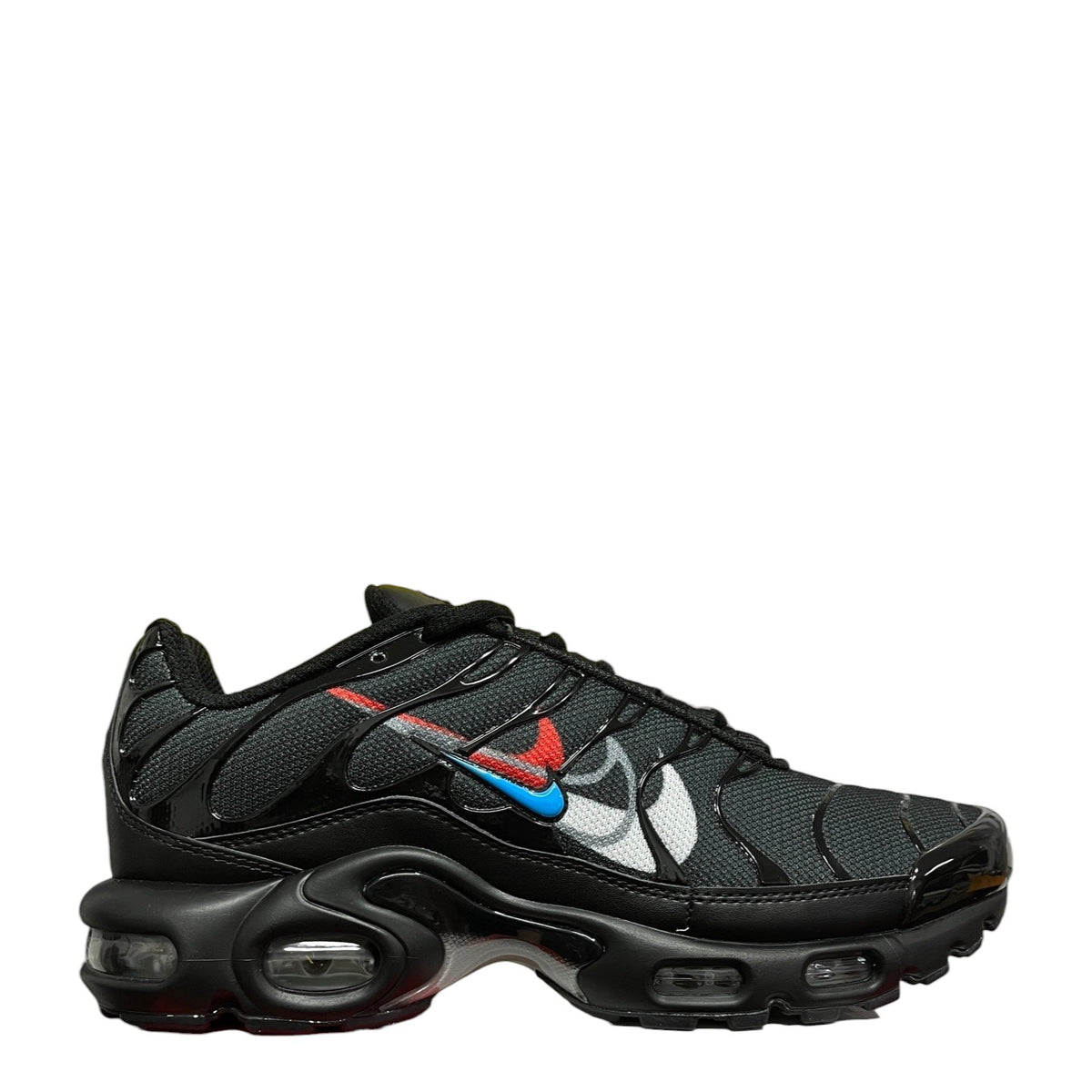 Luxury Chef Nike Air Max Plus TN black sneakers with red, blue, and white accents. Mesh and patent leather.