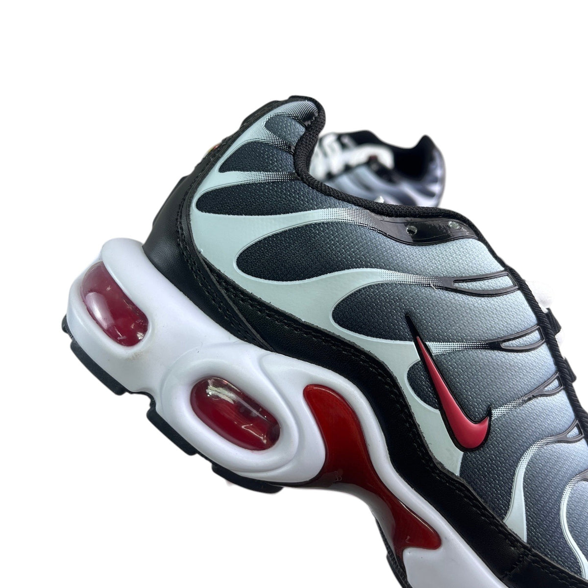 Luxury Chef Nike TN sneakers in black, grey, and white with red accents and visible air cushioning.