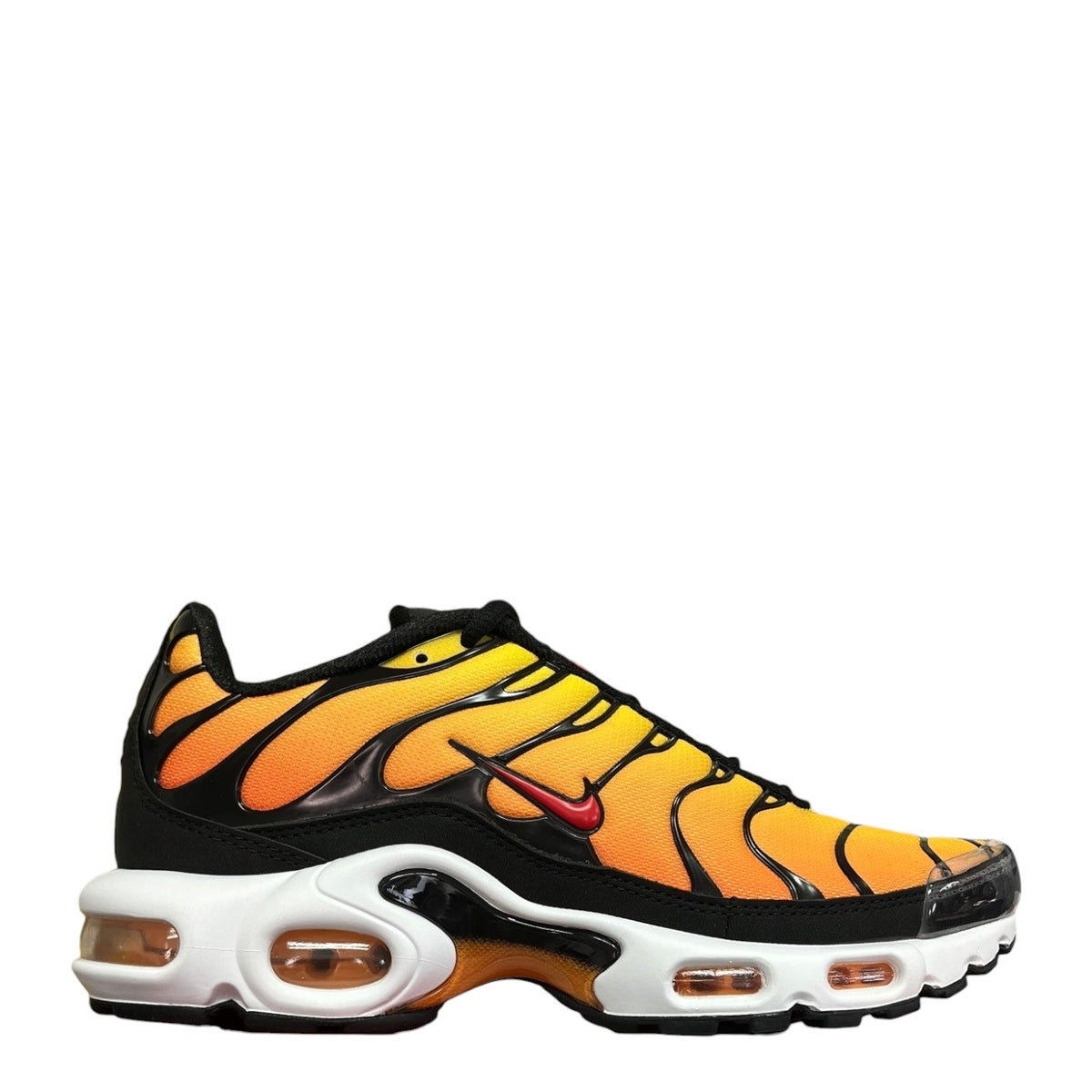 Luxury Chef Nike Air Max Plus TN sneakers with orange and yellow gradient mesh upper, black overlays, and white sole.