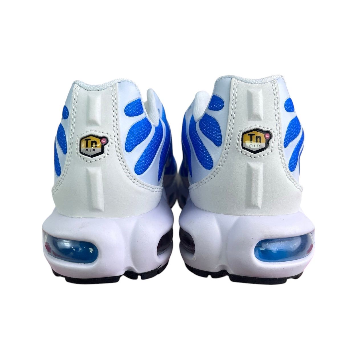Luxury Chef Nike TN sneakers with white leather and blue wave accents. Features visible air cushioning.